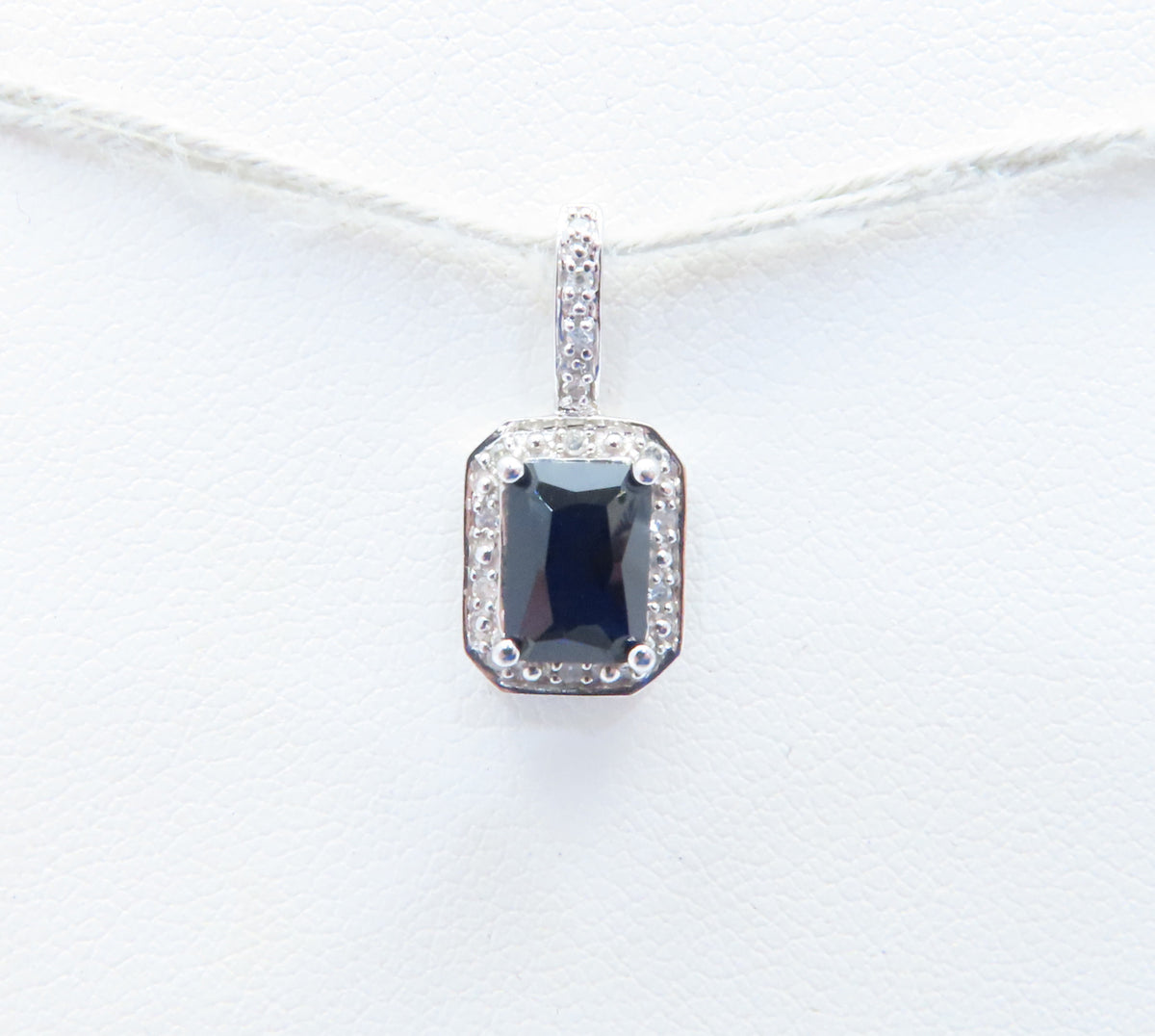 10K White Gold Emerald Cut Sapphire & Diamond Accent Halo Pendant