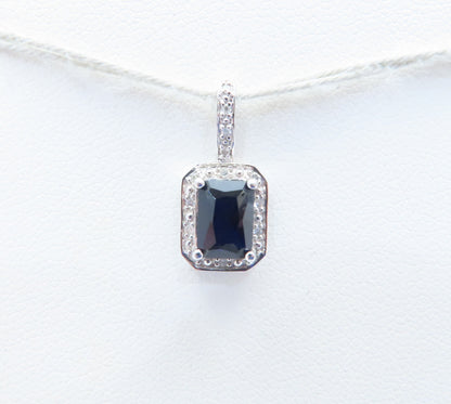 10K White Gold Emerald Cut Sapphire & Diamond Accent Halo Pendant