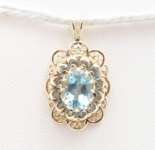 10k Yellow Gold Oval Blue Topaz with Blue Topaz Halo Scalloped Pendant